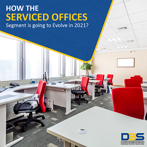 Bright modern office with white desks and red chairs, showcasing serviced office layout